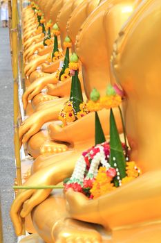 a row of golden buddha statue