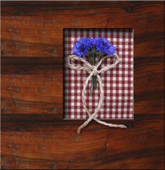 wooden frame background with blue flowers, copyspace
