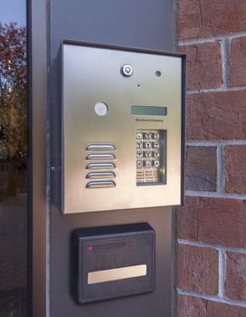 Electronic door directory and security pad near the front door entrance of a commercial building