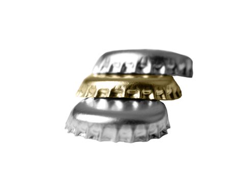 Pile of stoppers from beer on a white background.