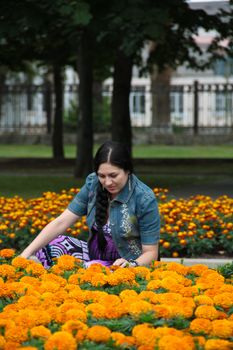 The pregnant girl on walk in city park