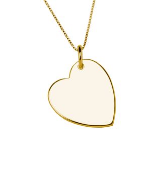 Golden heart pendant isolated on white background