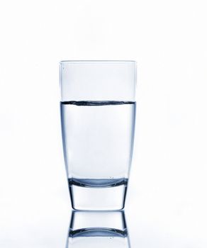 water on glass isolated on white background
