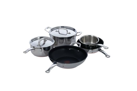 Stainless steel pots and pans isolated on white