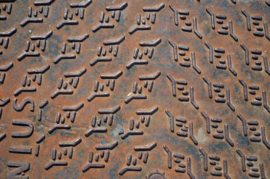 Background of rusty iron steel street well cover lid.