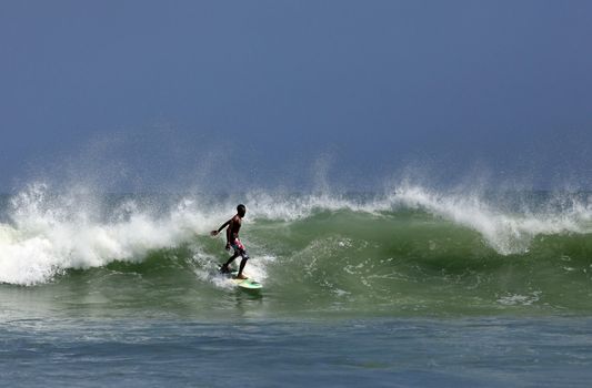 Man-surfer in ocean. Bali. Indonesia