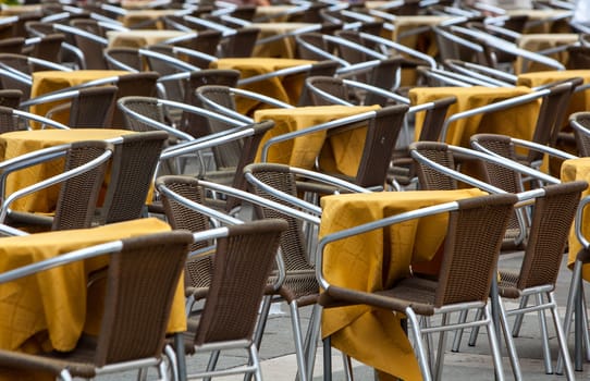 Image of a empty yellow terrace in a city street.