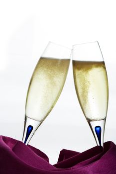 Two glasses of champagne on white background