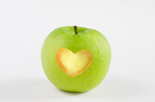 fresh green apple with heart shape