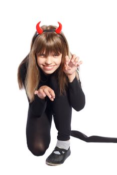 girl in devil costume waving his tail on a white background