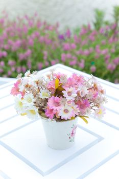 white vase and flower on the white table