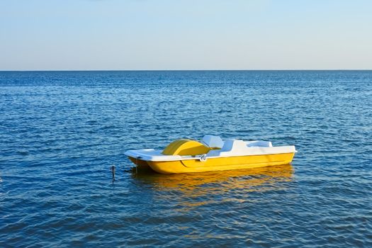 Walking pedal catamaran on the sea water in a fine summer day