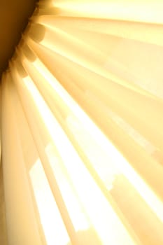 Sunlight falling through a semi transparent curtain.