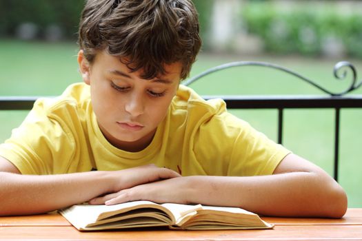 Teenage boy reading a book