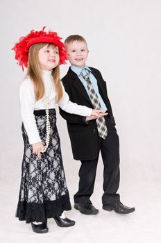 Smiling boy and girl hold each other's hand