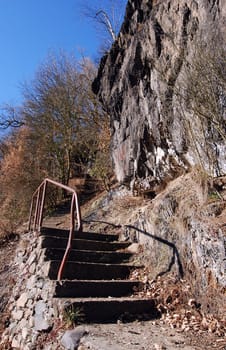 Narrow stair path leads through the wild rock