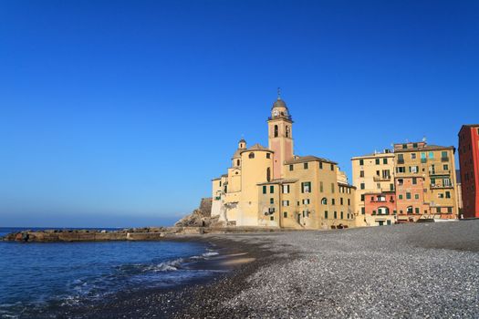 beach and church in Camogli, famous small town in Mediterranean sea, Italy