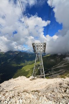 aerial view of Primiero valley with cableway pylon on foreground, Trentino, Italy