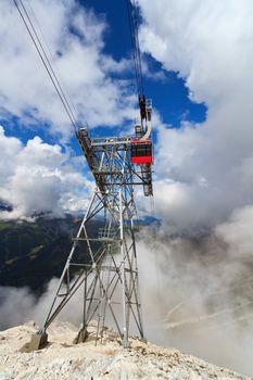 summer view of Primiero valley with cableway pylon on foreground, San Martino di Castrozza, Trentino, Italy