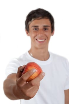 young swarthy man with  brown eyes and a red apple in his hand on white background