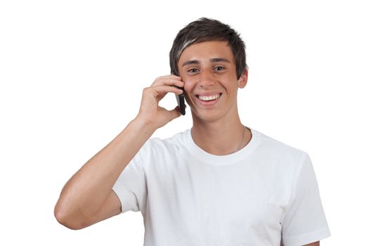 young swarthy man with  brown eyes talking via cellphone to someone on white background