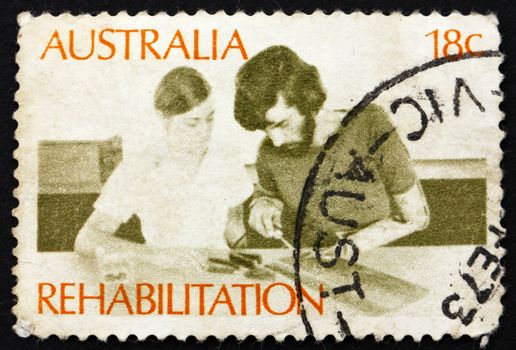 AUSTRALIA - CIRCA 1972: a stamp printed in the Australia shows Amputee Assembling Electrical Circuit, Rehabilitation of the Handicapped, circa 1972