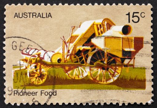 AUSTRALIA - CIRCA 1972: a stamp printed in the Australia shows Combine Harvester, 19th Century, Australian Pioneer Life, circa 1972