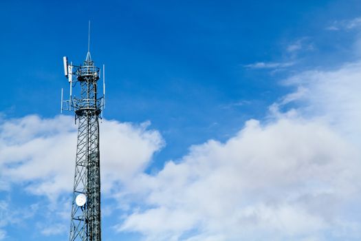 Communication tower over a blue sky background