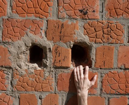 Hand keeps for an aperture in a brick wall