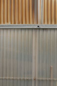 Aluminum and corrugated plastic background. Greenhouse construction detail.