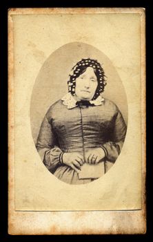 UK - CIRCA 1870. Victorian lady with uncombed hair probably in mourning holds a letter with bad news. Sourced from antique cabinet card vintage photograph, created by unknown photographer, UK, circa 1870.