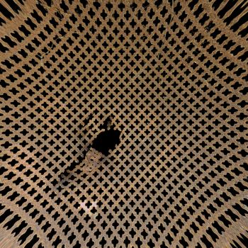 Rusty perforated metal surface. Worn iron grille distorted background texture.