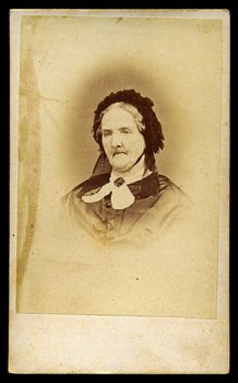 Portrait of Victorian old lady with bonnet. Sourced from antique cabinet card vintage photograph created by E. Matthews, Islington, London UK, circa 1870.