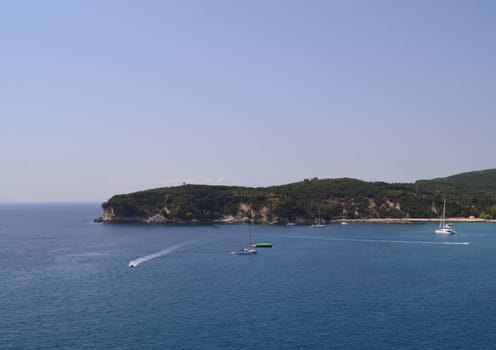 The rocky coast washed by the warm sea