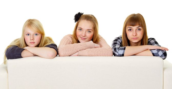 Group of teenage friends on the couch isolated on white background