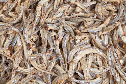 Whitebait on the market counter - edible anchovies background