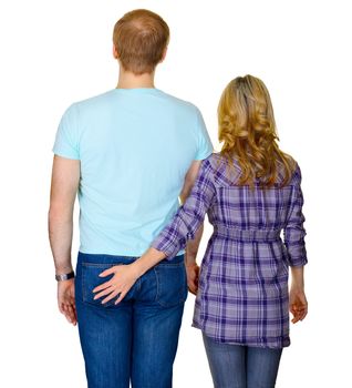 Young couple - rear view isolated on white background