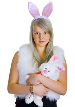 A young blonde in a fancy-dress with toy rabbit isolated on white background