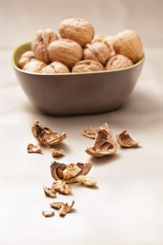 Walnut in a bowl, beige color