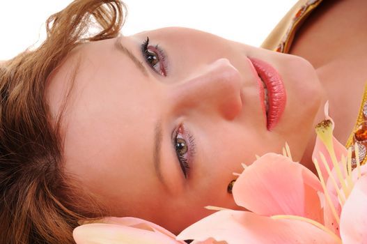 Close-up beauty woman face with lily flowers