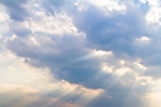 Rays of light shining through the clouds on cloudy day