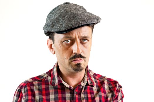 Closeup portrait of a young man man wearing a cap, isolated on white background