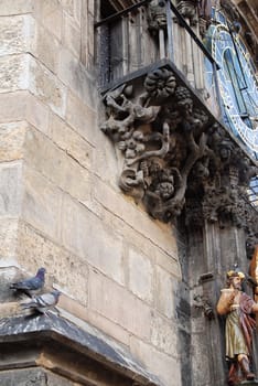 Astronomical clock in Prague and a pair of pigeons 