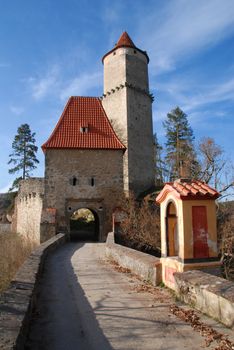 Medieval castle Zvikov in the Czech Republic with round tower, draw-bridge and blue sky