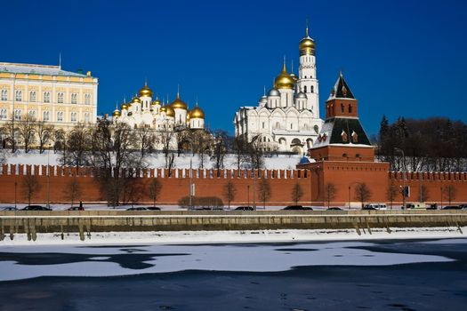 The red brick walls of famous Kremlin in Moscow with its churches
