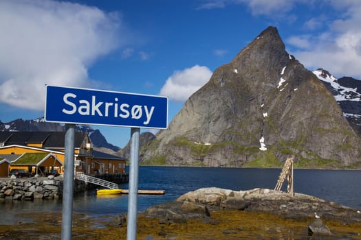 Village of Sakrisoy with traditional yellow fishing harbor on Lofoten islands in Norway