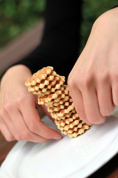 making a tower of wafer cookies