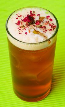 tea ice, iced tea with ice cubes on background