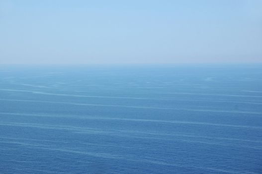 Ocean currents deep sea water and sky horizon. Nature background.
