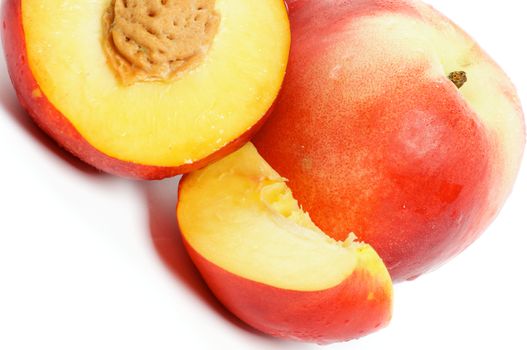 Three nectarines full body, half and slice isolated on white background